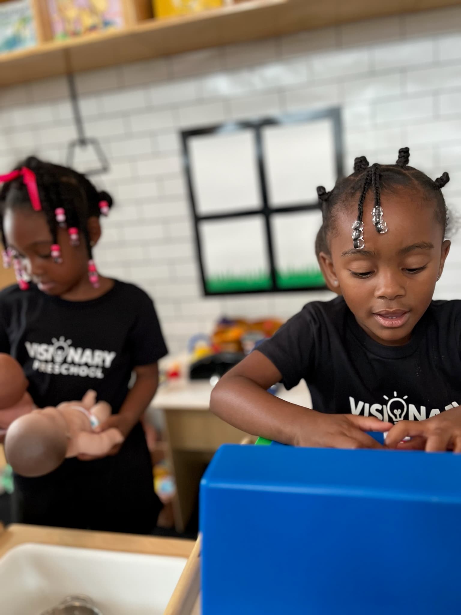 Child building school-readiness skills through hands-on learning