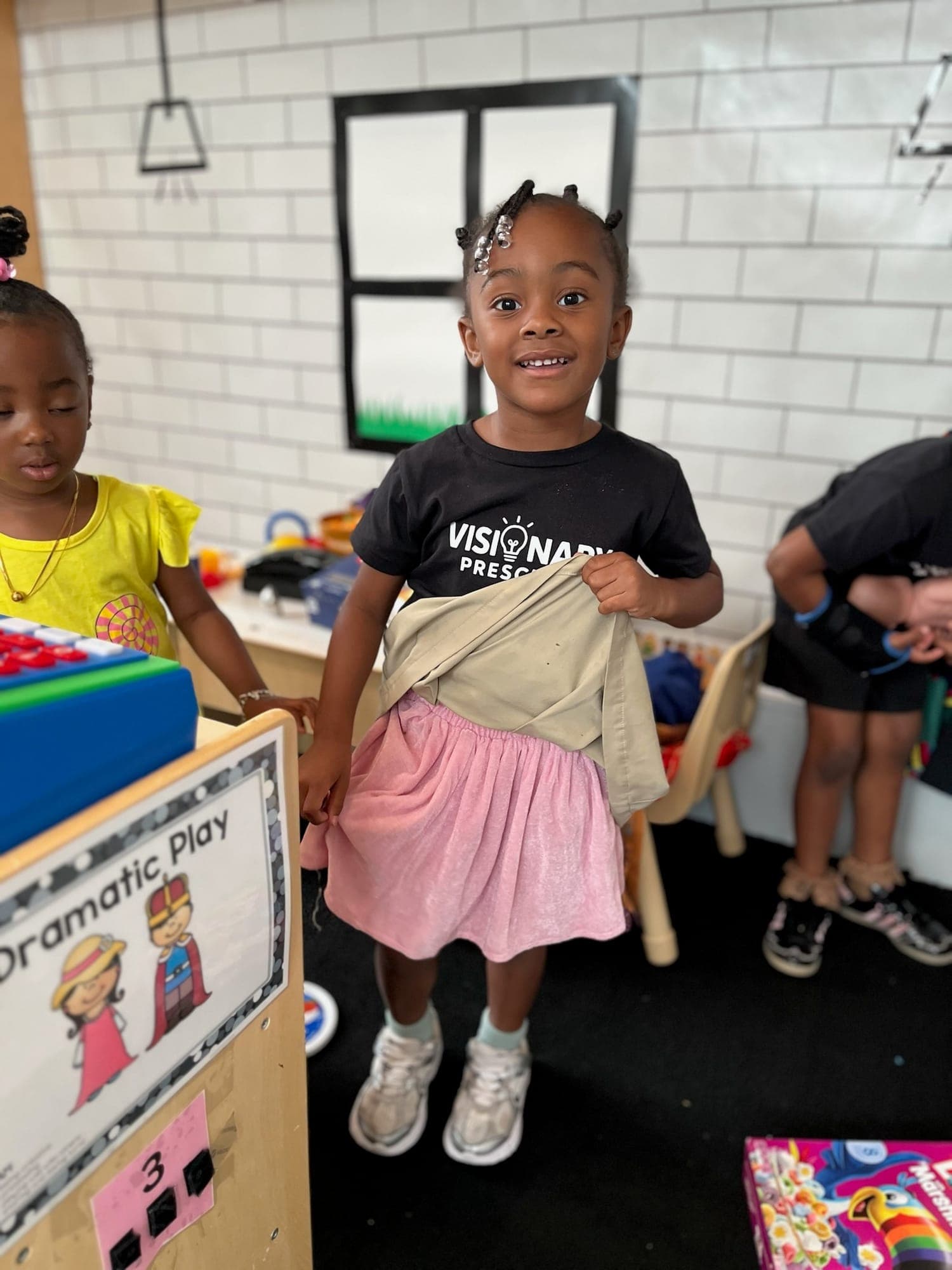 Explorer confidently participating in the dramatic play area