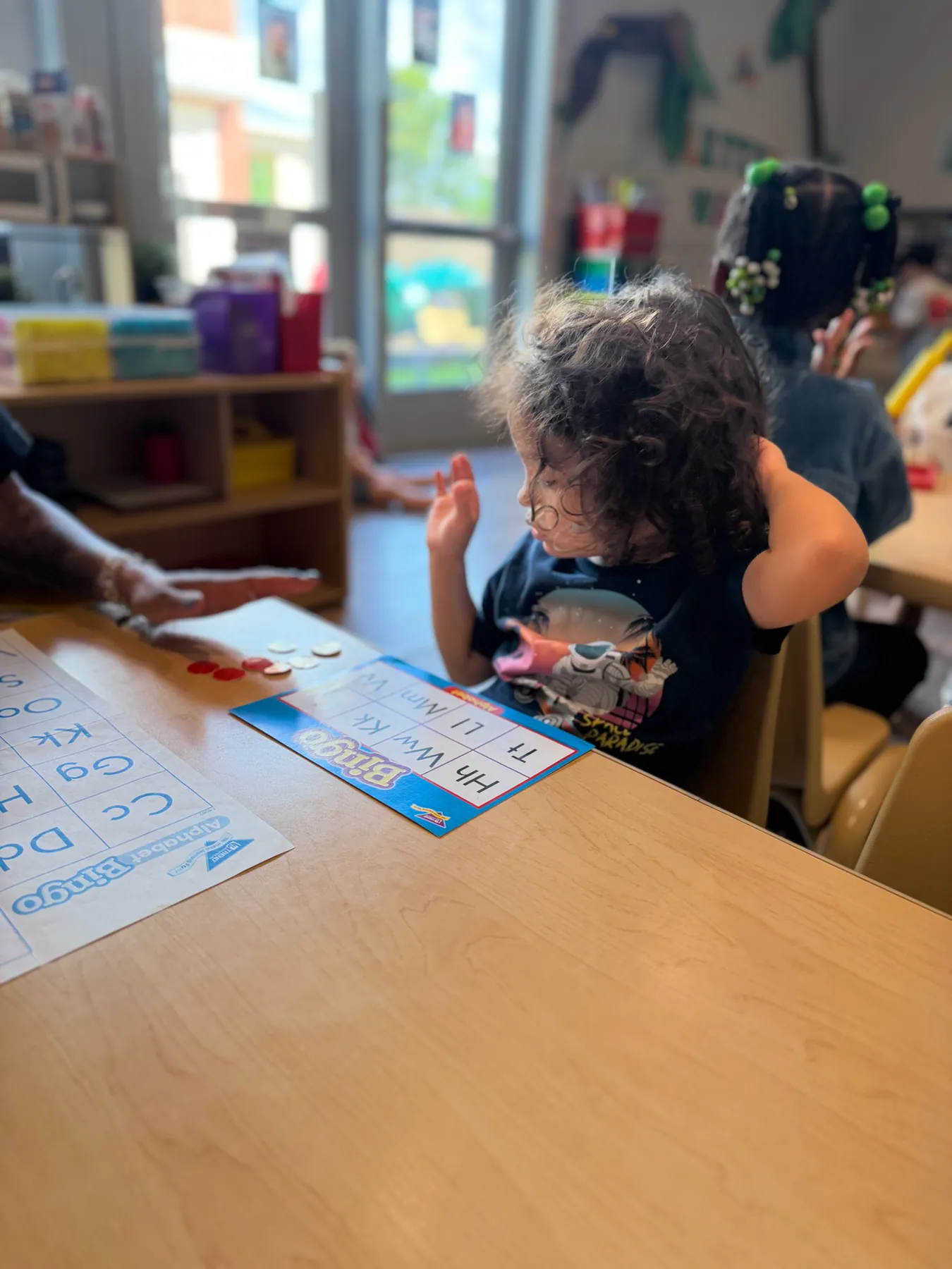 Staff member attentively monitoring a child's wellbeing