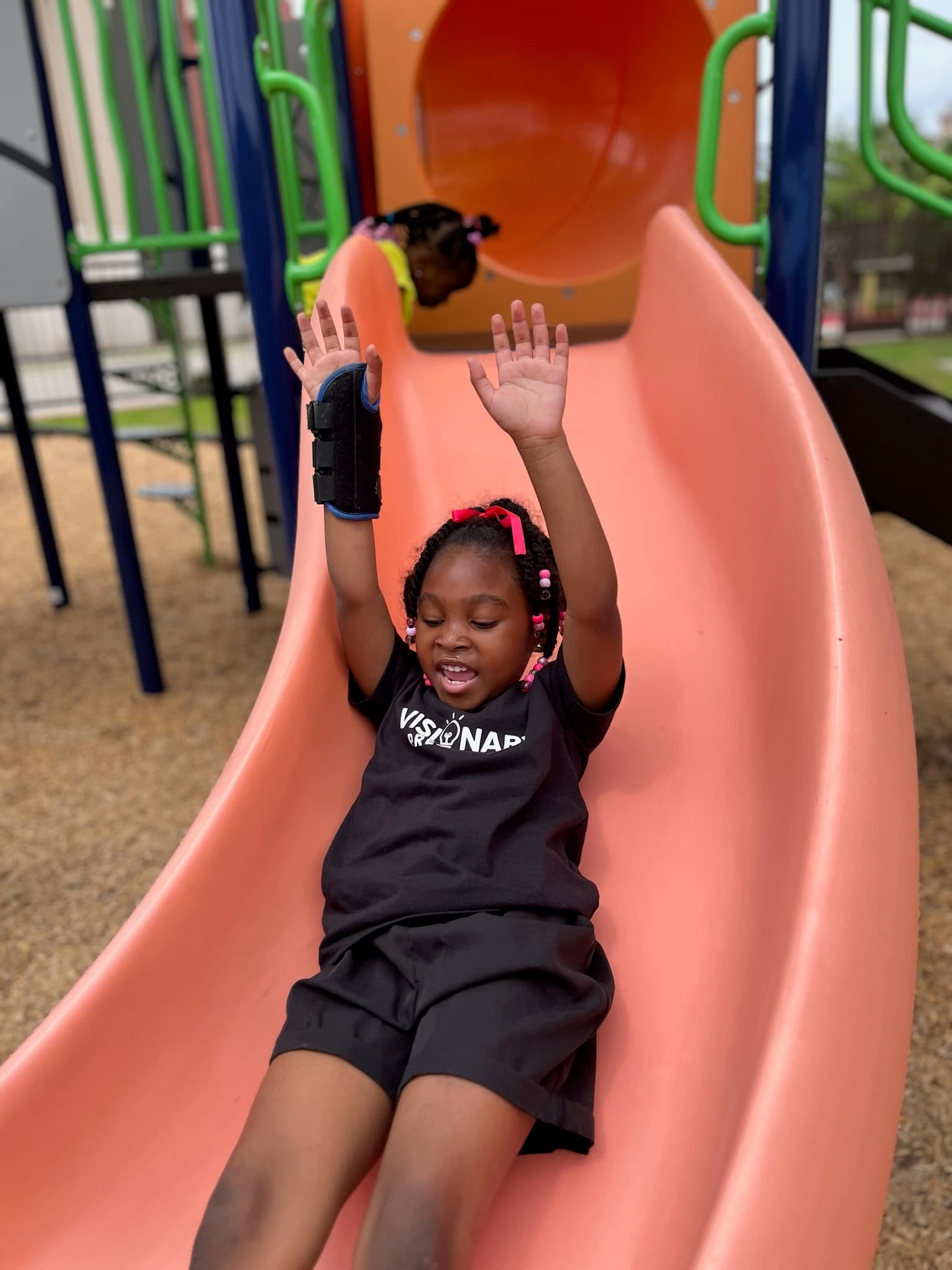 Child enjoying the playground slide