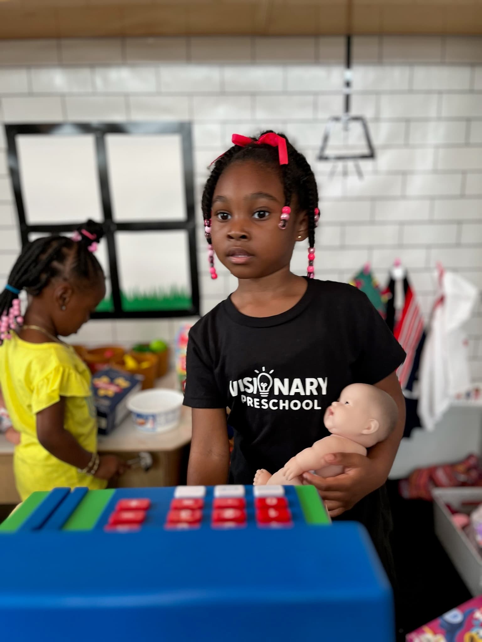 Child engaged in a school-readiness classroom activity