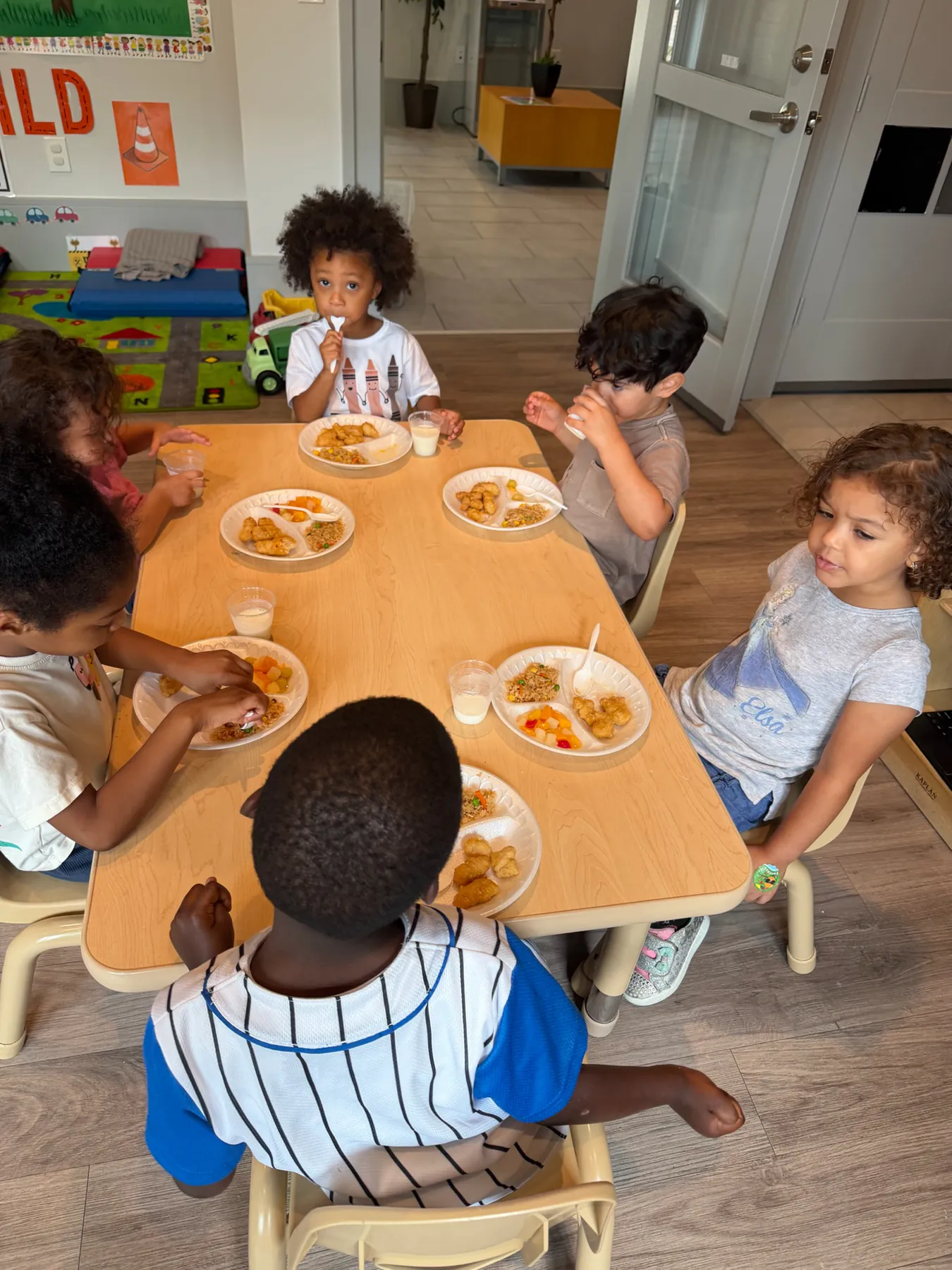 Children enjoying a balanced classroom meal together