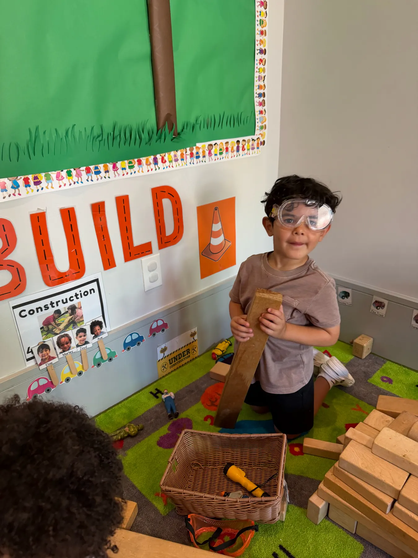Child taking part in an imaginative summer construction project