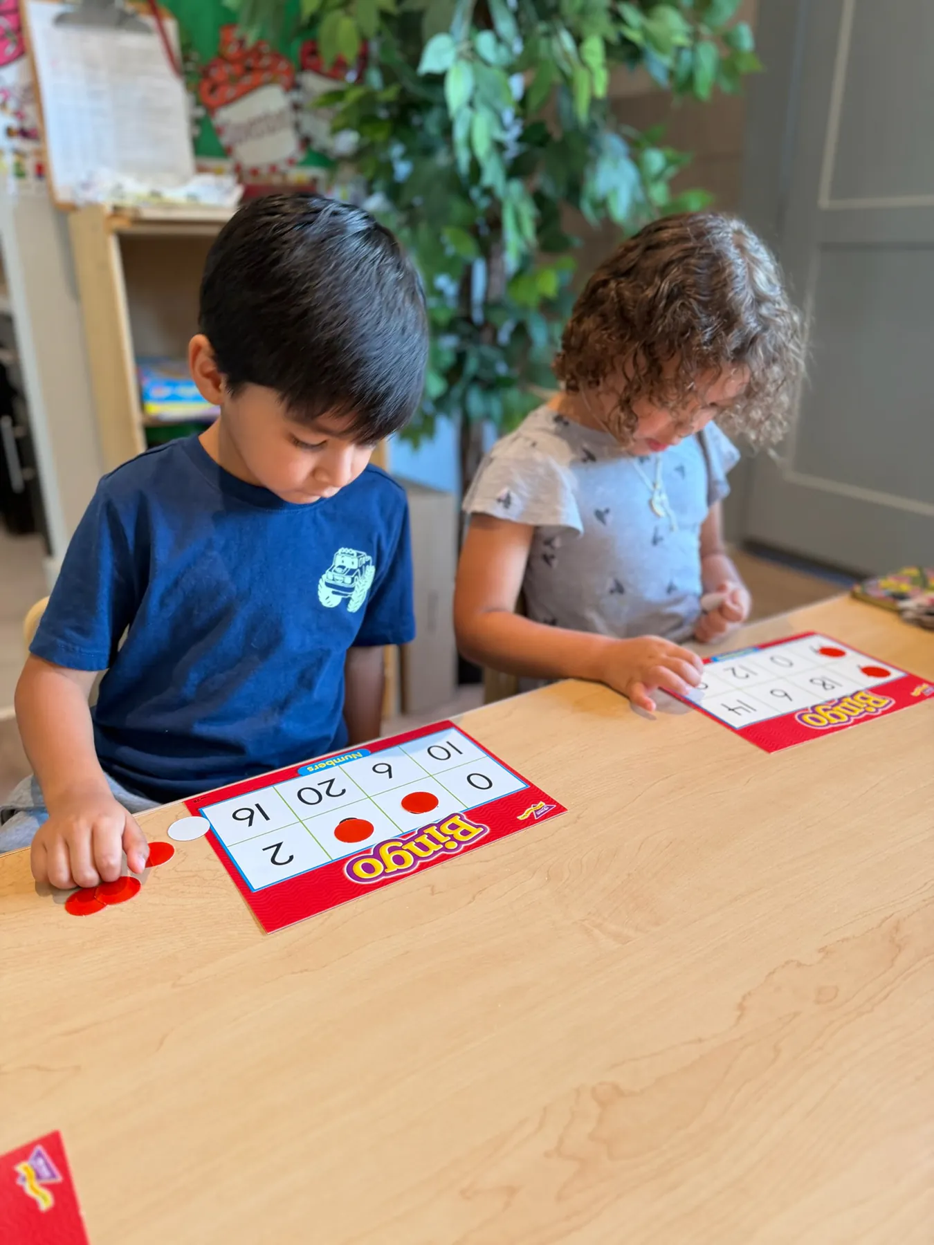 Visionaries students practicing number concepts with classroom materials